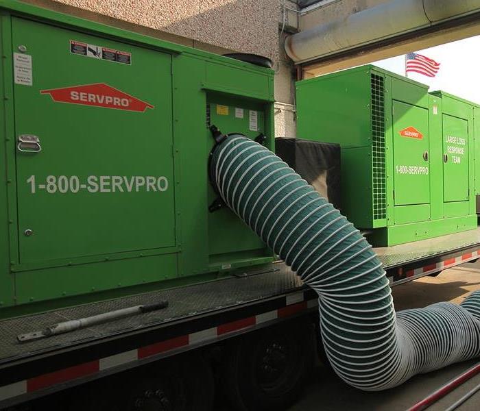 Large Generator with Hoses Connected to it